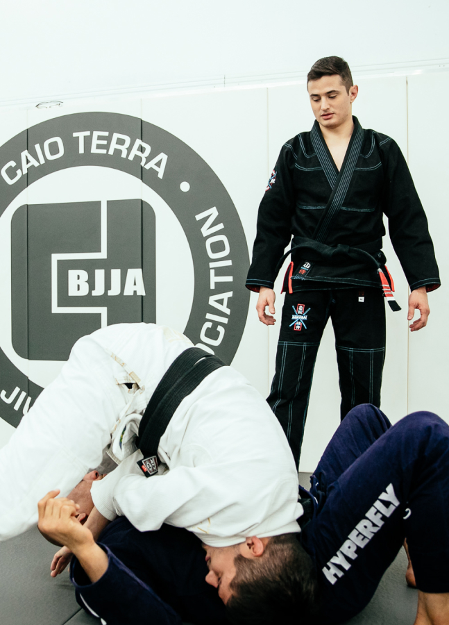 Instructors learning and practicing sparring techniques at the Caio Terra Brazilian Jiu-Jitsu Association.