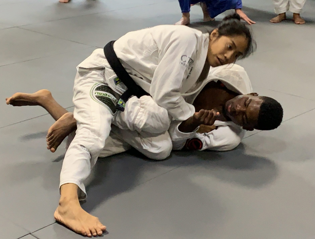 Adult martial arts students sparring at JMA BKNY, Brooklyn.